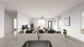 A modern kitchen with a granite countertop and a sink.